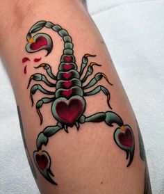 a scorpion tattoo with hearts on it's back legs and arms, in the shape of a heart