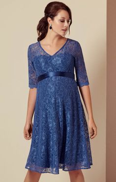 The fun, floaty shape of our Flossie maternity party dress makes it perfect for parties. Cut from premium corded blue floral lace and lined with contrasting dusky blue jersey. The adorable vintage touches are in abundance, from the scallop edging to the stylish ¾ sleeves – to smooth and flatter hips and bump. The perfect dress to see you through a stylish engagement during pregnancy, finish at the waist with a glorious French Blue satin sash (sold separately) to cinch you beautifully. Sweetheart Blue Short Sleeve Dress With Lace Patchwork, Fitted Lace Maternity Dress V-neck, Blue Lace Patchwork Dress, Blue Lace Dress With Lace Patchwork, Blue Fitted Lace Patchwork Dress, Blue Lace Dress With Lace Bodice For Spring, Elegant Short Sleeve Lace Maternity Dress, Spring Maternity Lace Dress, Blue Lace Patchwork Dress For Party