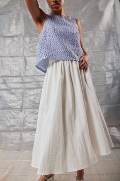 The Gathered Skirt is an easy-to-wear staple perfect for adding a little movement to your silhouette. It features a wide elastic waistband and a midi-length, perfect for wearing on top of shorts or activewear, or dressing up for a summer wedding. Versatile Summer Maxi Skirt, Versatile Long Skirt For Summer, Versatile Spring Maxi Skirt, Versatile Gathered Skirt Bottoms For Spring, Versatile Gathered Maxi Skirt For Spring, Versatile Gathered Skirt For Spring, Casual Asymmetrical Maxi Skirt With Gathered Detail, Casual Asymmetrical Gathered Maxi Skirt, Summer Stretch Asymmetrical Maxi Skirt