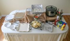 the table is set up with dishes and utensils for an appetizer