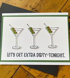 three martini glasses with olives in them on a card that says let's get extra dirty - tonight