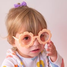 Let your little one's style bloom with these adorable, flower-shaped sunglasses in the shade Apricot! Keep your kiddo stylish and protected with this must-have accessory. Perfect for sunny days and even sunnier moods! One size 1-5 years UV protection Playful Sunglasses For Summer Playtime, Cute Sunglasses With Uv Protection For Playtime, Playful Flower-shaped Plastic Sunglasses, Cute Flower Shaped Sunglasses With Uv Protection, Playful Sunglasses With Uv Protection, Playful Orange Plastic Sunglasses, Cute Spring Sunglasses With Uv Protection, Cute Sunglasses With Uv Protection For Spring, Cute Sunglasses With Uv Protection