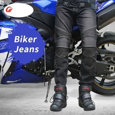 a man sitting on top of a blue and black motorbike in front of a gray background