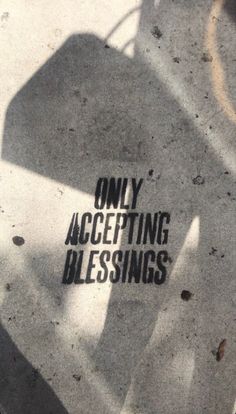 the words only accepting blessing are shown in black on a white background with an image of a hand holding a bag