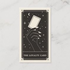 a hand holding a card with the words, the loyaity card on it