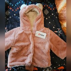 Pat Pat Fuzzy Bear Jacket...Hood Had Ear...Bottom Of Coat Has Fuzzy Round Tail... Pink With White Interior ..Brand New With Tags Cute Winter Hooded Jacket, Cute Winter Outerwear With Fleece Lining, Cute Outerwear With Fleece Lining For Cold Weather, Cute Outerwear With Fleece Lining For Winter, Cute Hooded Outerwear For Playtime, Cute Warm Hooded Outerwear, Cute Long Sleeve Warm Outerwear, Cute Warm Long Sleeve Outerwear, Cute White Outerwear With Fleece Lining