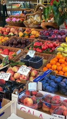 many different types of fruits and vegetables on display