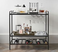 a shelf with bottles and glasses on it