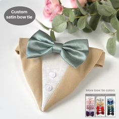 the bow tie is made from fabric and has buttons on it, as well as flowers