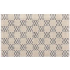 a white rug with grey squares on it