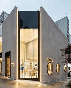 a store front with the lights on and windows lit up