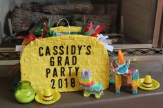 a yellow sign sitting on top of a table next to a fire place and other decorations