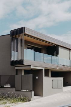 a modern building with balconies on the roof