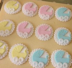 decorated cookies are arranged in the shape of baby carriages