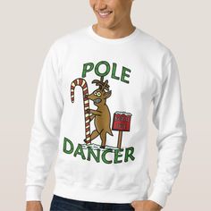 a man wearing a sweatshirt that says pole dancer with a reindeer holding a candy cane