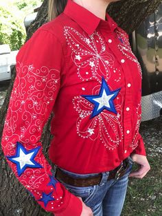 Be the talk of the Rodeo crowd with your beautifully patriotic and unique AJD Custom Design Embroidered shirt. You supply the shirt we do the embroidery and stoning. WE MAKE THESE TO ORDER. We love to make custom orders. 🤩 Note: $20.00 Shipping Cost Includes $4.00 for Insurance. Western Style Red Long Sleeve Tops, Red Western Long Sleeve Tops, Red Long Sleeve Western Top, Americana Long Sleeve Tops With American Flag Print, Americana Long Sleeve Tops For 4th Of July, Long Sleeve Americana Tops For 4th Of July, Long Sleeve Tops For 4th Of July, Red Long Sleeve Top For 4th Of July, Red Long Sleeve Tops For 4th Of July