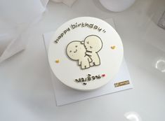 a birthday cake with an image of two elephants on it