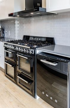 a kitchen with an oven, stove and range in the middle of the countertop