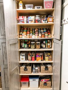 an organized pantry with lots of food in baskets and bins on the bottom shelf