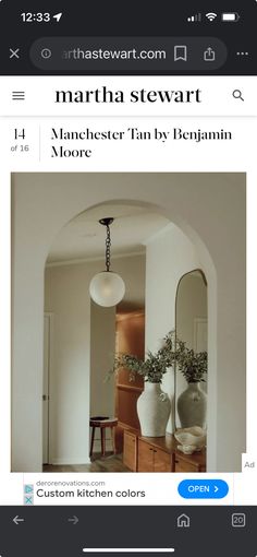 the homepage for martha stewart's website is displayed in an iphone photo, and there are two vases with plants on them