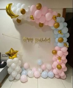 a birthday party with balloons and stars