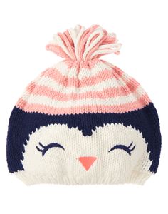 a knitted hat with a penguin face on the front and pink, white, and blue stripes