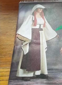 an image of a woman wearing a costume on the cover of a magazine or dvd