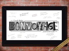 the word bonyoyage written in black and white ink on a brick wall