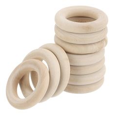 stack of wooden rings on white background with clippings for use in crafts and diy projects