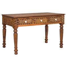 an ornate wooden table with drawers on one side and two smaller drawers on the other