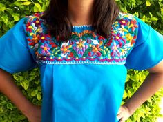 Traditional  Handmade Embroidery mexican Blouse. (Plus size - Full figured sizes)I know it is not just me who’s noticed that it is getting harder and harder to find clothes that fit those beautiful curves, that is why we would like to be inclusive in all sizes, from XS to XXXL.Need a special size? We could make it - Message us!Ideal for a boho and vintage chic look with Folk Fabric flowers, for everyday or beach, perfect to combine with denim.Match with a Embroidery Belt for a better look. (Also Blue Short Sleeve Folk Blouse, Blue Folk Style Short Sleeve Blouse, Blue Short Sleeve Tops For Festivals, Embroidered Blue Tops For Festivals, Blue Tops With Embroidered Border For Spring, Traditional Blue Tops With Embroidered Border, Blue Embroidered Tops For Festivals, Blue Folk Top With Embroidered Border, Blue Folk Style Top With Embroidered Border