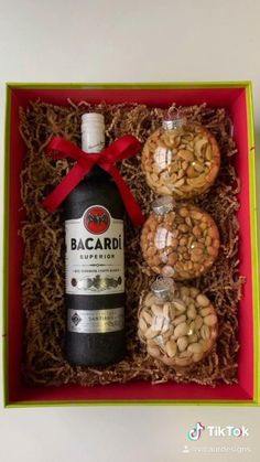 a bottle of bacardi and some nuts in a box