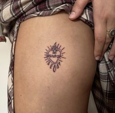 a woman with a tattoo on her thigh