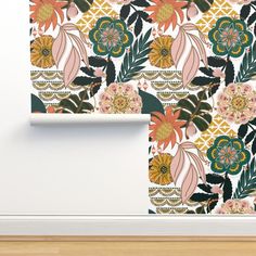 a wall with flowers and leaves on it in front of a white wallpaper background