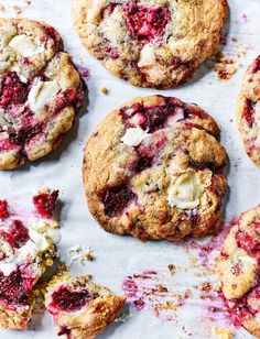 raspberry and white chocolate crumbled cookies on parchment paper