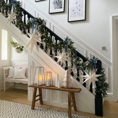 a staircase decorated with christmas decorations and candles