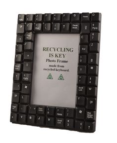 a black computer keyboard with the words recycling is key