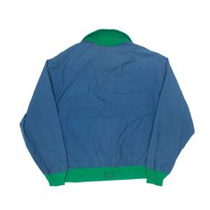 Item is in good used condition. >Size: L >Armpit To Armpit: 24" >Armpit To Cuff: 19" >Collar To Hem: 25" Retro Blue Windbreaker For Streetwear, Blue Retro Windbreaker For Streetwear, 90s Style Blue Track Jacket For Streetwear, 90s Blue Track Jacket For Streetwear, Vintage Blue Track Jacket With Pockets, 90s Blue Windbreaker For Streetwear, 90s Style Blue Track Jacket For Outdoor, Blue Cotton Windbreaker With Pockets, 90s Style Hooded Blue Windbreaker