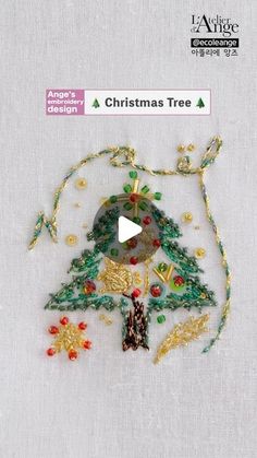 a christmas tree ornament made out of beads and thread on a white background