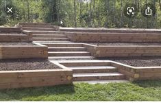 several wooden steps are lined up in the grass