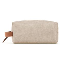 Indulge in the quiet luxury of this minimally-minded travel pouch. Made from a lightweight linen blend, this carry on–worthy style is finished with a whimsical poly lining so you can tote your toiletries with confidence. Designed with an internal zip pocket for stowing your smallest sundries—and a side loop handle for easy carrying or hanging from a hook—no detail is overlooked in the design of this jet-set essential. Minimalist Cream Travel Bag, Beige Linen Canvas Bag For Travel, Beige Linen Travel Canvas Bag, Beige Linen Canvas Travel Bag, Travel-ready Beige Linen Canvas Bag, Cream Rectangular Cosmetic Bag For Travel, Rectangular Cream Travel Cosmetic Bag, Cream Rectangular Pouch For Travel, Beige Linen Travel Bag