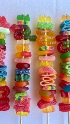 there are many colorful candy lollipops on the stick