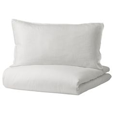 two white pillows sitting next to each other on top of a pillow case with an open end