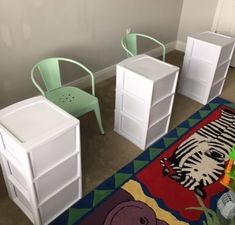 three children's chairs and two tables in a room with a rug on the floor