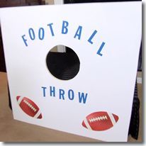 a football throw sign is hanging on the wall