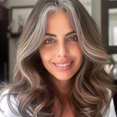 25 Best Hair Colors for Gray Hair, According to Experts Brunette Hair Going Grey, Ash Gray Hair Color For Morena, Brunette Gray Hair, Warm Gray Hair Color, Hair Color Ideas To Blend Grey Hair, Grey Hair Blending Brunette, Dark Hair Gray Blending, Best Color For Graying Hair, Gray Blending Brown Hair