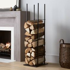 a fireplace with firewood stacked in front of it