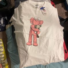 Brand New 100% Authentic Kaws Shirt From A Crazy Legendary Drop Super Hyped Youtube It It’s Crazy Historic Size Xl Get It Now ! Trendy White Shirt For Loungewear, White Graphic Print Shirt For Loungewear, White Crew Neck Shirt For Loungewear, White Graphic Print Top For Loungewear, White Relaxed Fit Shirt For Loungewear, Casual Shirt With Graphic Print For Loungewear, White Cotton Loungewear Shirt, White Cotton Shirt For Loungewear, Trendy Cotton Loungewear Shirt