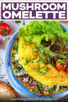 an omelette with mushrooms, lettuce and tomatoes