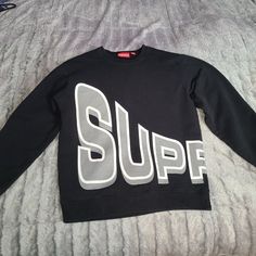 Supreme Crewneck Sweatshirt Designer Letter Print Sweatshirt For Streetwear, Designer Crew Neck Tops For Fall, Designer Long Sleeve Graphic Print Sweatshirt, Designer Graphic Print Long Sleeve Sweatshirt, Designer Black Long Sleeve Sweatshirt, Designer Black Sweatshirt With Logo Print, Designer Black Crew Neck Top, Supreme Crewneck, Supreme Sweatshirt